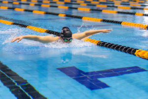 Mary in the pool swimming butterfly