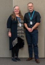 Karen Stobbs (Past Principal) standing with Saul Taylor (new Principal)