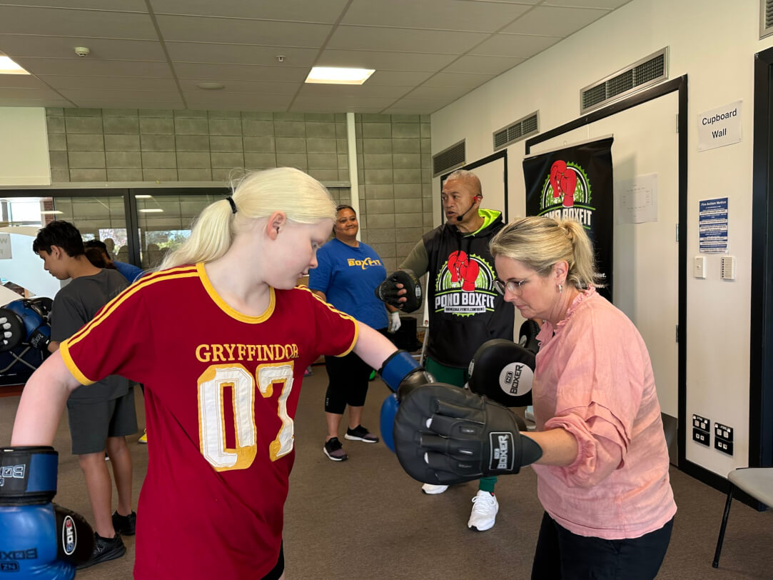 Figure 2 - Immersion staff member and ākonga standing with boxing gloves on doing Boxfit